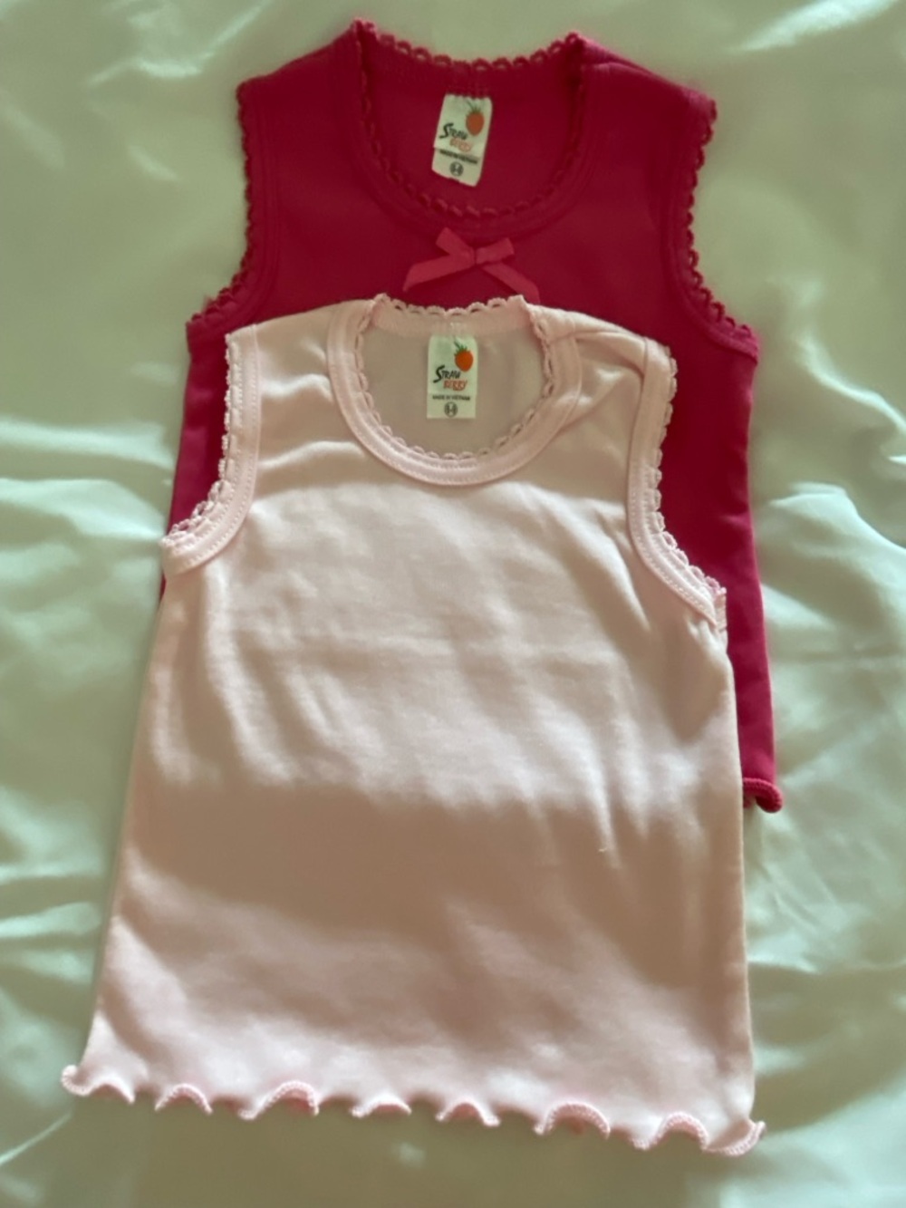 1-Girl’s' Pink or Hot Pink Tank Tops. Size run big
Pick your color